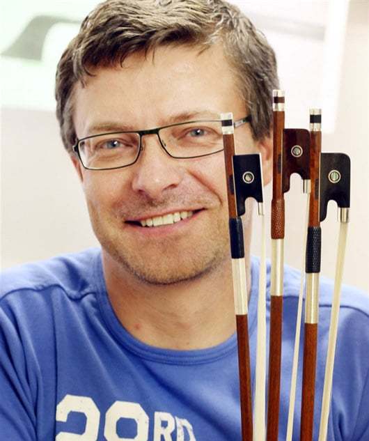 Picture of bowmaker Radek Horcicka, slightly smiling.